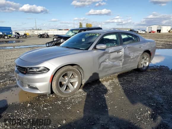2018 Dodge Charger SXT Plus z VIN 2C3CDXHG7JH162849, wystawiony jako Copart lot #90515255 z przebiegiem 74 757 mil mil oraz Szkoda całkowita • Salvage title. Historia ofert i sprzedaży dostępna na DreamBid. Obrazek 1.