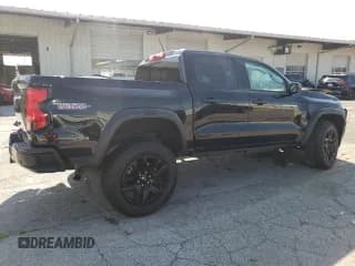 ✅ 2023 Chevrolet Colorado 4WD Trail Boss • VIN: 1GCPTEEK6P1216050 • Лот: 65768384. Опубликован ранее на Copart с пробегом 11 070 миль. Бесплатный доступ к архиву аукционных продаж из США и подробный отчёт об истории автомобиля на DreamBid. Изображение 3.