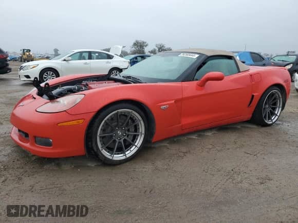 2013 Chevrolet Corvette 427 1SB with VIN 1G1YY3DE5D5702223, listed as a Copart auction lot 39260444 with 55,937 mi miles and Salvage title. Bid and sale history available at DreamBid. Image 1.