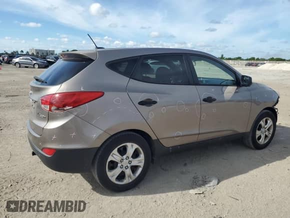 2013 Hyundai Tucson GL z VIN KM8JT3AB5DU654984, wystawiony jako Copart lot #72258644 z przebiegiem 123 394 mil mil oraz Szkoda całkowita • Salvage title. Historia ofert i sprzedaży dostępna na DreamBid. Obrazek 3.