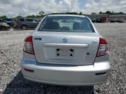 ✅ 2012 Suzuki SX4 LE • VIN: JS2YC5A34C6305573 • Лот: 61501735. Опубликован ранее на Copart с пробегом 123 367 миль. Бесплатный доступ к архиву аукционных продаж из США и подробный отчёт об истории автомобиля на DreamBid. Изображение 6.