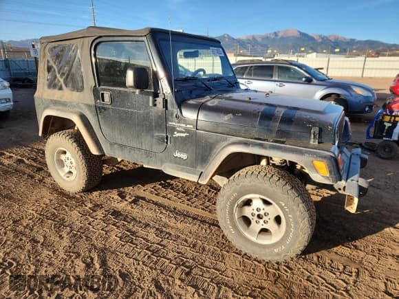 ✅ 2000 Jeep Wrangler Sport • VIN: 1J4FA49S9YP738234 • Lot: 91114555. Listed on Copart with 245,066 mi. Free auction sales archive from the USA and detailed vehicle history report at DreamBid. Image 4.