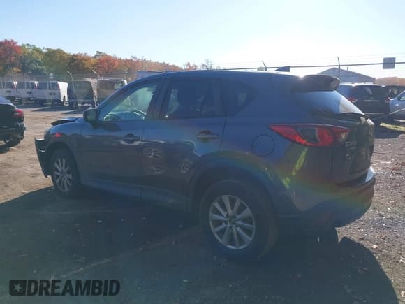 ✅ 2016 Mazda CX-5 Touring • VIN: JM3KE4CY5G0716056 • Lot: 43521281. Listed on IAAI with 107,968 mi. Free auction sales archive from the USA and detailed vehicle history report at DreamBid. Image 3.