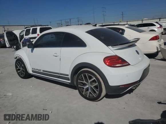 ✅ 2016 Volkswagen Beetle Dune • VIN: 3VWS17AT0GM633772 • Lot: 82483095. Listed on Copart with 73,990 mi. Free auction sales archive from the USA and detailed vehicle history report at DreamBid. Image 2.
