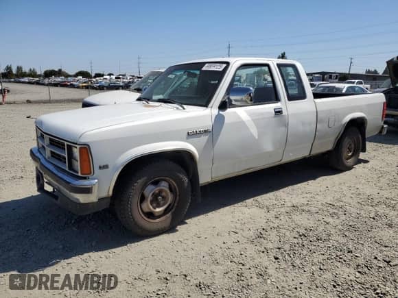 1990 Dodge Dakota with VIN 1B7GL23XXLS708226, listed as a Copart auction lot 69859125 with 372,216 mi miles and Salvage title. Bid and sale history available at DreamBid. Image 1.