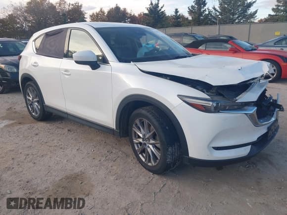 ✅ 2019 Mazda CX-5 Grand Touring • VIN: JM3KFBDM1K0650496 • Lot: 43483224. Listed on IAAI with 107,358 mi. Free auction sales archive from the USA and detailed vehicle history report at DreamBid. Image 1.