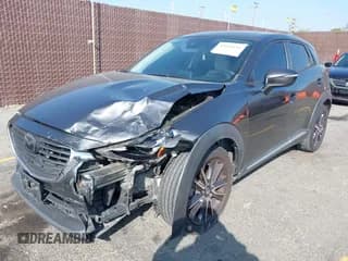 ✅ 2018 Mazda CX-3 Grand Touring • VIN: JM1DKDD75J0300077 • Лот: 43516551. Опубликован ранее на IAAI с пробегом 81 554 миль. Бесплатный доступ к архиву аукционных продаж из США и подробный отчёт об истории автомобиля на DreamBid. Изображение 2.