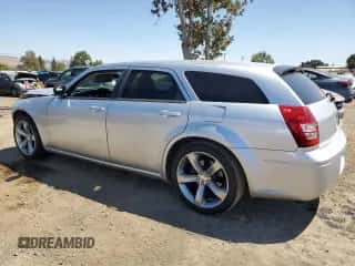 2005 Dodge Magnum SE с VIN 2D4FV48V15H166052, выставлен на аукционе Copart как лот 69713374 с пробегом 174 582 миль миль и Списание • Salvage title. История ставок и продаж доступна на DreamBid. Изображение 2.