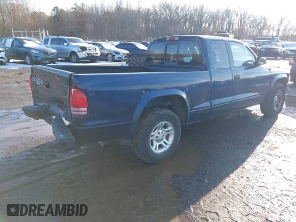 2002 Dodge Dakota Sport z VIN 1B7GL32X52S569340, wystawiony jako IAAI lot #41541480 z przebiegiem 176 632 mil mil oraz . Historia ofert i sprzedaży dostępna na DreamBid. Obrazek 4.