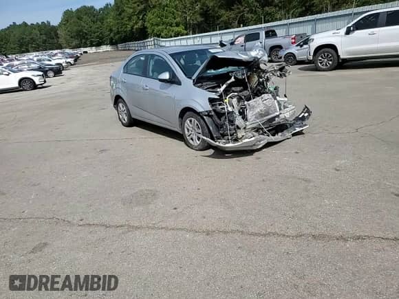 2017 Chevrolet Sonic LS с VIN 1G1JB5SH2H4123651, выставлен на аукционе Copart как лот 82694485 с пробегом Не указан миль и Списание • Salvage title. История ставок и продаж доступна на DreamBid. Изображение 14.