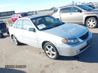 ✅ 2002 Mazda Protege DX • VIN: JM1BJ226621561710 • Lot: 43508258. Wystawiony na IAAI z przebiegiem 202 896 mil. Bezpłatny archiwum sprzedaży aukcyjnych z USA i szczegółowy raport historii pojazdu na DreamBid. Zdjęcie 1.