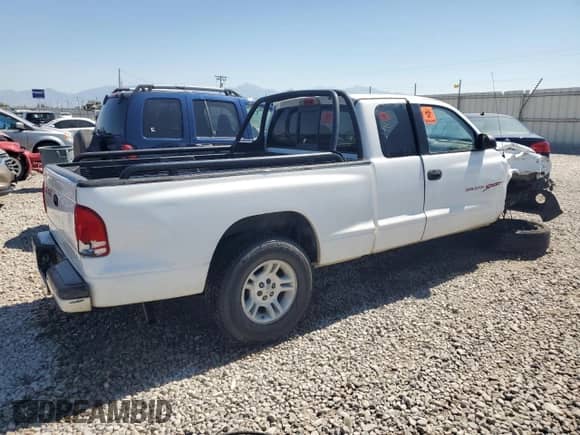 1999 Dodge Dakota SLT z VIN 1B7GL22Y6XS108819, wystawiony jako Copart lot #70400164 z przebiegiem Nie podano mil oraz Szkoda całkowita • Salvage title. Historia ofert i sprzedaży dostępna na DreamBid. Obrazek 3.
