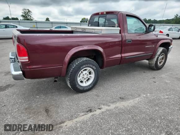 2000 Dodge Dakota Sport z VIN 1B7GG26N5YS650791, wystawiony jako Copart lot #63601765 z przebiegiem 80 841 mil mil oraz Szkoda całkowita • Salvage title. Historia ofert i sprzedaży dostępna na DreamBid. Obrazek 3.
