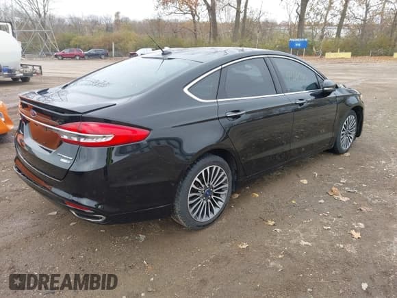 ✅ 2018 Ford Fusion Titanium • VIN: 3FA6P0D99JR241593 • Lot: 43640460. Listed on IAAI with 63,550 mi. Free auction sales archive from the USA and detailed vehicle history report at DreamBid. Image 4.