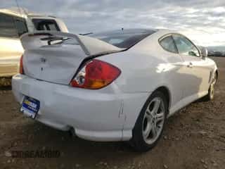 2004 Hyundai Tiburon GT с VIN KMHHN65F84U116609, выставлен на аукционе Copart как лот 89343225 с пробегом 162 133 миль миль и Списание • Salvage title. История ставок и продаж доступна на DreamBid. Изображение 4.