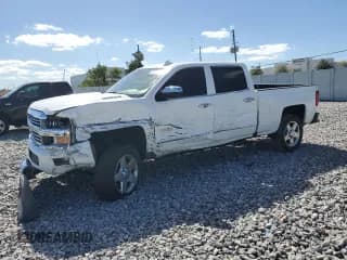 ✅ 2015 Chevrolet Silverado 2500HD High Country • VIN: 1GC1KXE85FF677959 • Лот: 90101215. Опубликован ранее на Copart с пробегом 146 383 миль. Бесплатный доступ к архиву аукционных продаж из США и подробный отчёт об истории автомобиля на DreamBid. Изображение 1.