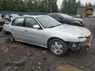 2003 Chevrolet Malibu LS z VIN 1G1NE52J33M604691, wystawiony jako Copart lot #84902294 z przebiegiem Nie podano mil oraz Szkoda całkowita • Salvage title. Historia ofert i sprzedaży dostępna na DreamBid. Obrazek 4.