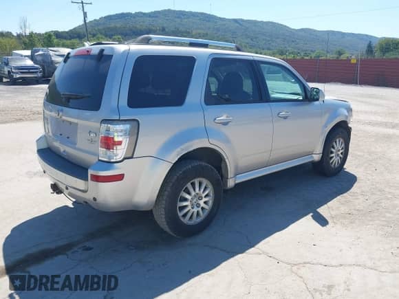 2010 Mercury Mariner Premier z VIN 4M2CN9HGXAKJ16116, wystawiony jako IAAI lot #43140056 z przebiegiem 194 370 mil mil oraz . Historia ofert i sprzedaży dostępna na DreamBid. Obrazek 4.