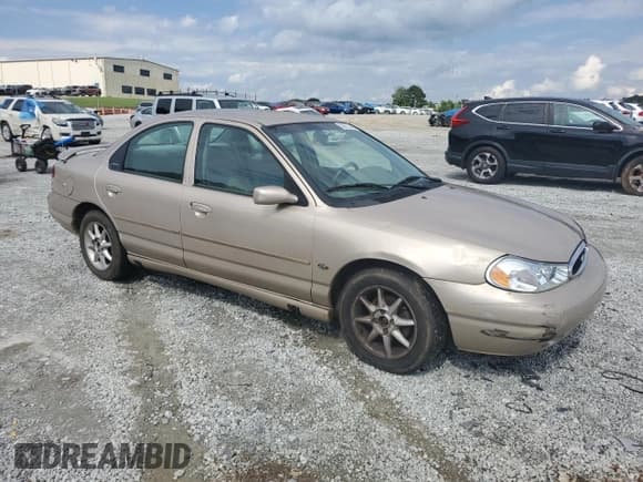 ✅ 1998 Ford Contour LX • VIN: 1FAFP66L6WK302776 • Lot: 56873245. Listed on Copart with 189,661 mi. Free auction sales archive from the USA and detailed vehicle history report at DreamBid. Image 4.