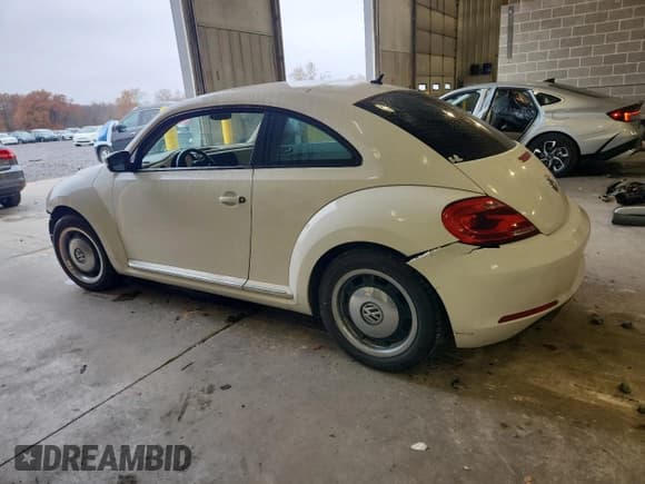 ✅ 2013 Volkswagen Beetle 2.5L • VIN: 3VWJX7AT1DM632703 • Lot: 92857275. Listed on Copart with 144,477 mi. Free auction sales archive from the USA and detailed vehicle history report at DreamBid. Image 2.