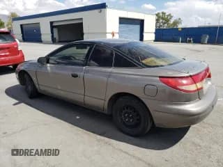 ✅ 1999 Saturn SC • VIN: 1G8ZN1288XZ310351 • Лот: 76677414. Опубликован ранее на Copart с пробегом Не указан. Бесплатный доступ к архиву аукционных продаж из США и подробный отчёт об истории автомобиля на DreamBid. Изображение 2.