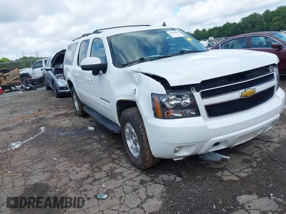 2014 Chevrolet Suburban LT z VIN 1GNSCJE07ER211222, wystawiony jako IAAI lot #42428084 z przebiegiem 214 712 mil mil oraz . Historia ofert i sprzedaży dostępna na DreamBid. Obrazek 1.