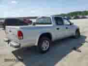 2003 Dodge Dakota SLT z VIN 1D7HL48XX3S197440, wystawiony jako Copart lot #61722005 z przebiegiem 167 398 mil mil oraz Czysty tytuł • Clean title. Historia ofert i sprzedaży dostępna na DreamBid. Obrazek 3.