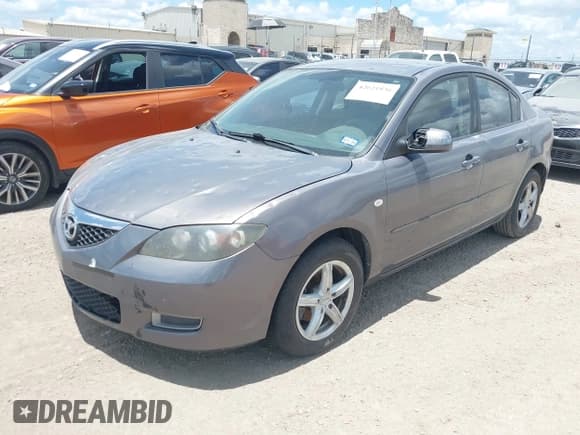 ✅ 2009 Mazda 3 i Touring Value • VIN: JM1BK32FX91231033 • Lot: 42621836. Wystawiony na IAAI z przebiegiem 163 748 mil. Bezpłatny archiwum sprzedaży aukcyjnych z USA i szczegółowy raport historii pojazdu na DreamBid. Zdjęcie 2.