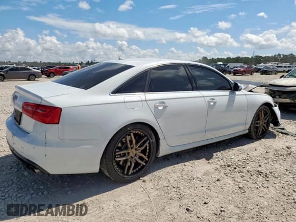 ✅ 2013 Audi S6 • VIN: WAUF2CFCXDN084096 • Лот: 62227495. Опубликован ранее на Copart с пробегом 99 899 миль. Бесплатный доступ к архиву аукционных продаж из США и подробный отчёт об истории автомобиля на DreamBid. Изображение 3.