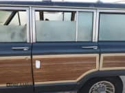 ✅ 1989 Jeep Grand Wagoneer • VIN: 1J4GS5875KP101837 • Лот: 74897344. Опубликован ранее на Copart с пробегом 163 342 миль. Бесплатный доступ к архиву аукционных продаж из США и подробный отчёт об истории автомобиля на DreamBid. Изображение 12.