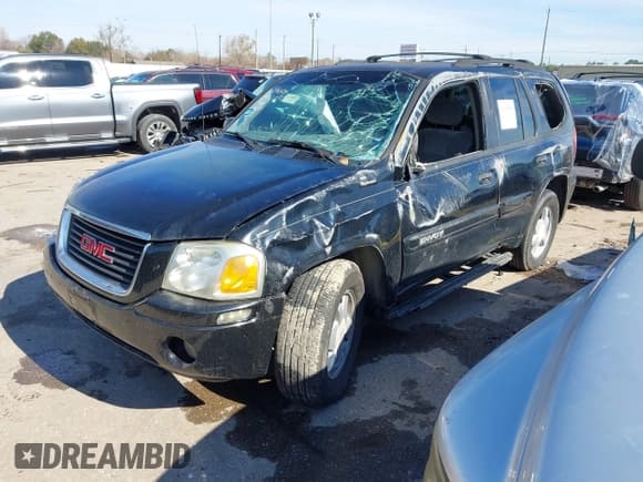 ✅ 2003 GMC Envoy SLE • VIN: 1GKDS13S732134354 • Lot: 41305506. Listed on IAAI with 221,733 mi. Free auction sales archive from the USA and detailed vehicle history report at DreamBid. Image 2.