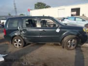 ✅ 2014 Honda Pilot EX-L • VIN: 5FNYF4H59EB001648 • Lot: 43266430. Listed on IAAI with 117,461 mi. Free auction sales archive from the USA and detailed vehicle history report at DreamBid. Image 13.