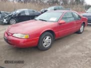 ✅ 1997 Ford Thunderbird LX • VIN: 1FALP6248VH134894 • Lot: 41551957. Listed on IAAI with 136,435 mi. Free auction sales archive from the USA and detailed vehicle history report at DreamBid. Image 2.
