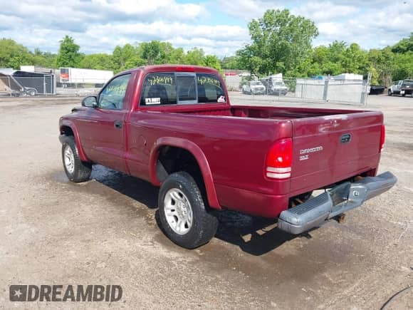 2003 Dodge Dakota with VIN 1D7GG16X73S130005, listed as a IAAI auction lot 42306999 with 257,954 mi miles and . Bid and sale history available at DreamBid. Image 3.
