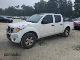 2012 Nissan Frontier SV with VIN 1N6AD0ER2CC433304, listed as a Copart auction lot 86213285 with 261,849 mi miles and Salvage title. Bid and sale history available at DreamBid. Image 1.