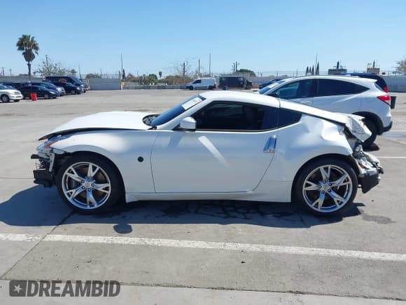 ✅ 2009 Nissan 370Z Touring • VIN: JN1AZ44E99M411252 • Lot: 41969671. Listed on IAAI with 91,873 mi. Free auction sales archive from the USA and detailed vehicle history report at DreamBid. Image 14.