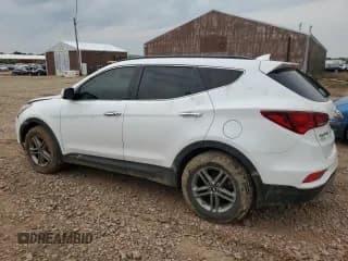 ✅ 2018 Hyundai Santa Fe 2.4L • VIN: 5XYZUDLB5JG554520 • Лот: 60901313. Опубликован ранее на Copart с пробегом 103 306 миль. Бесплатный доступ к архиву аукционных продаж из США и подробный отчёт об истории автомобиля на DreamBid. Изображение 2.
