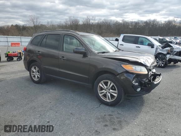 ✅ 2011 Hyundai Santa Fe SE • VIN: 5XYZHDAG1BG076522 • Lot: 87142914. Listed on Copart with 181,777 mi. Free auction sales archive from the USA and detailed vehicle history report at DreamBid. Image 4.
