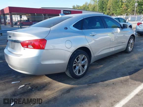 ✅ 2015 Chevrolet Impala LT • VIN: 2G1125S35F9200138 • Lot: 43256833. Listed on IAAI with 135,107 mi. Free auction sales archive from the USA and detailed vehicle history report at DreamBid. Image 4.