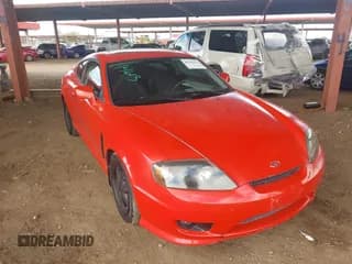 ✅ 2005 Hyundai Tiburon GS • VIN: KMHHM65DX5U156547 • Лот: 41786434. Опубликован ранее на IAAI с пробегом 135 532 миль. Бесплатный доступ к архиву аукционных продаж из США и подробный отчёт об истории автомобиля на DreamBid. Изображение 1.