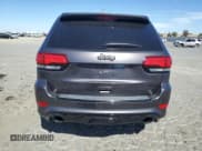 ✅ 2018 Jeep Grand Cherokee SRT • VIN: 1C4RJFDJ8JC488401 • Лот: 68311635. Опубликован ранее на Copart с пробегом 37 512 миль. Бесплатный доступ к архиву аукционных продаж из США и подробный отчёт об истории автомобиля на DreamBid. Изображение 6.