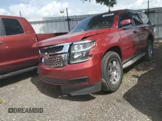 2015 Chevrolet Tahoe LS with VIN 1GNSCAKC0FR304020, listed as a Copart auction lot 56285505 with 186,105 mi miles and Salvage title. Bid and sale history available at DreamBid. Image 1.