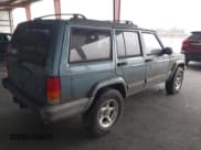 ✅ 1999 Jeep Cherokee Sport • VIN: 1J4FF68S4XL605305 • Lot: 43863356. Listed on IAAI with 232,672 mi. Free auction sales archive from the USA and detailed vehicle history report at DreamBid. Image 4.