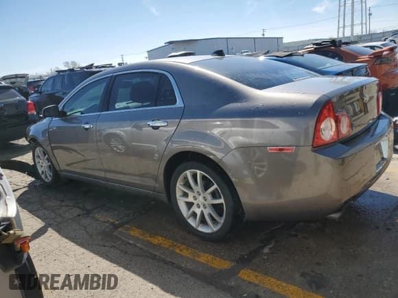 ✅ 2012 Chevrolet Malibu LTZ • VIN: 1G1ZG5E74CF281946 • Lot: 49991684. Listed on Copart with 152,608 mi. Free auction sales archive from the USA and detailed vehicle history report at DreamBid. Image 2.