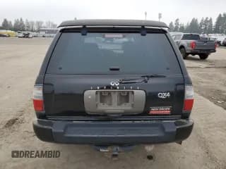 ✅ 2000 Infiniti QX4 • VIN: JNRAR07Y3YW082661 • Лот: 83142034. Опубликован ранее на Copart с пробегом 246 375 миль. Бесплатный доступ к архиву аукционных продаж из США и подробный отчёт об истории автомобиля на DreamBid. Изображение 6.