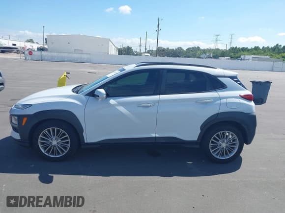 ✅ 2018 Hyundai Kona SEL • VIN: KM8K62AA5JU073459 • Лот: 43352612. Опубликован ранее на IAAI с пробегом 77 655 миль. Бесплатный доступ к архиву аукционных продаж из США и подробный отчёт об истории автомобиля на DreamBid. Изображение 14.