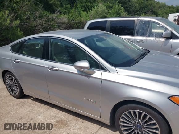 ✅ 2017 Ford Fusion Hybrid Titanium • VIN: 3FA6P0RU1HR317556 • Lot: 42549706. Listed on IAAI with 77,744 mi. Free auction sales archive from the USA and detailed vehicle history report at DreamBid. Image 13.