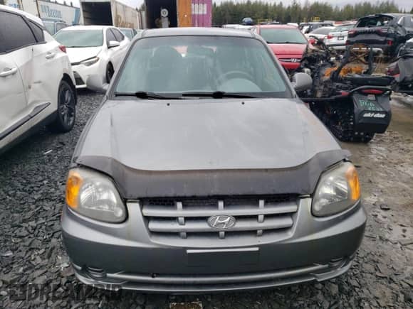 2005 Hyundai Accent GLS z VIN KMHCG45C55U617585, wystawiony jako Copart lot #47449285 z przebiegiem 141 635 mil mil oraz Szkoda całkowita • Salvage title. Historia ofert i sprzedaży dostępna na DreamBid. Obrazek 5.