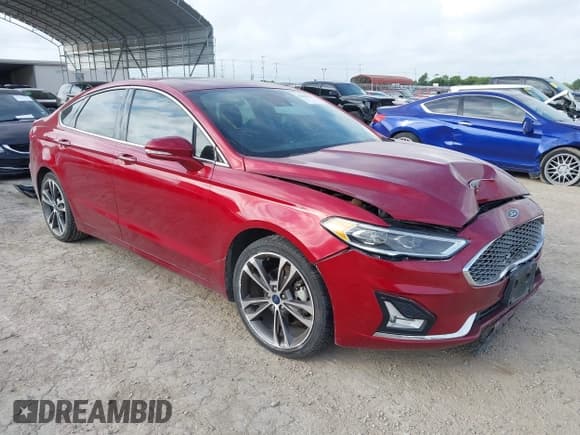 ✅ 2019 Ford Fusion Titanium • VIN: 3FA6P0K93KR132292 • Lot: 42803571. Listed on IAAI with 94,590 mi. Free auction sales archive from the USA and detailed vehicle history report at DreamBid. Image 1.