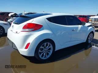 2014 Hyundai Veloster z VIN KMHTC6AD4EU213537, wystawiony jako IAAI lot #43358808 z przebiegiem 54 973 mil mil oraz . Historia ofert i sprzedaży dostępna na DreamBid. Obrazek 4.